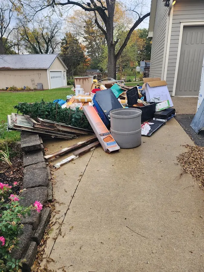 Dumpster being loaded with debris for 30 Yard Dumpster Rental in Richmond
